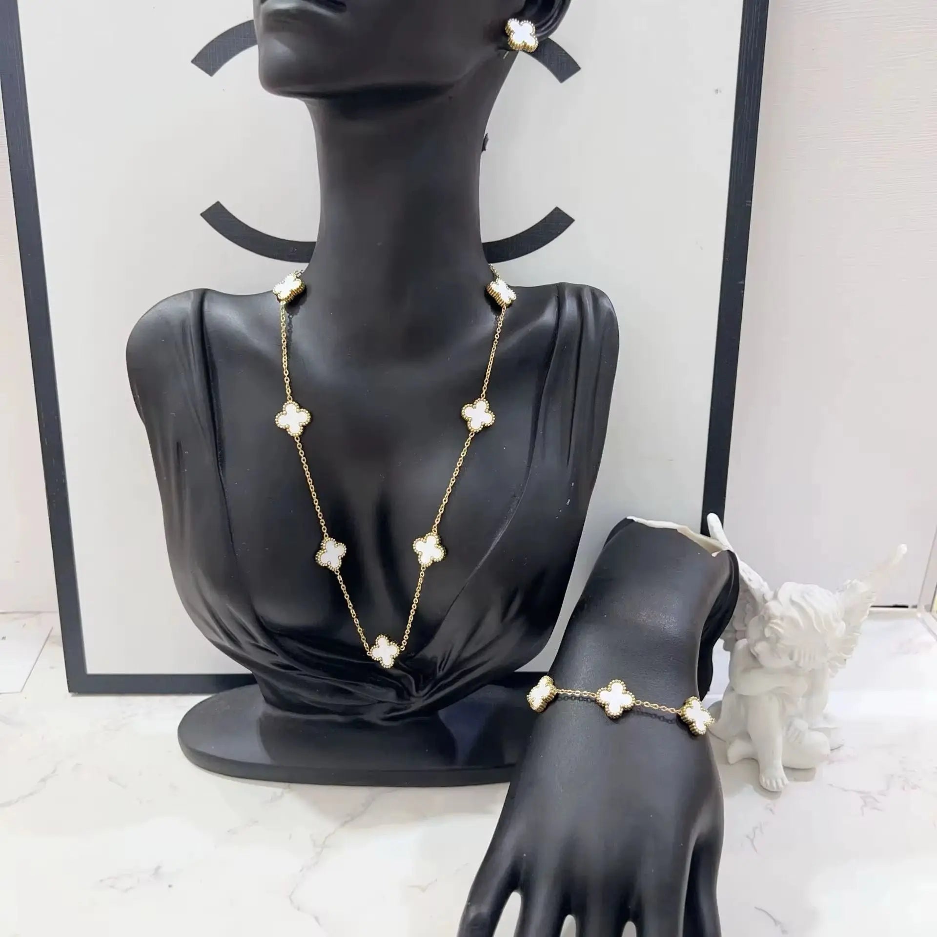 MARHOUHOU friendship necklace gift for her with white flower charms on gold chain displayed on black mannequin
