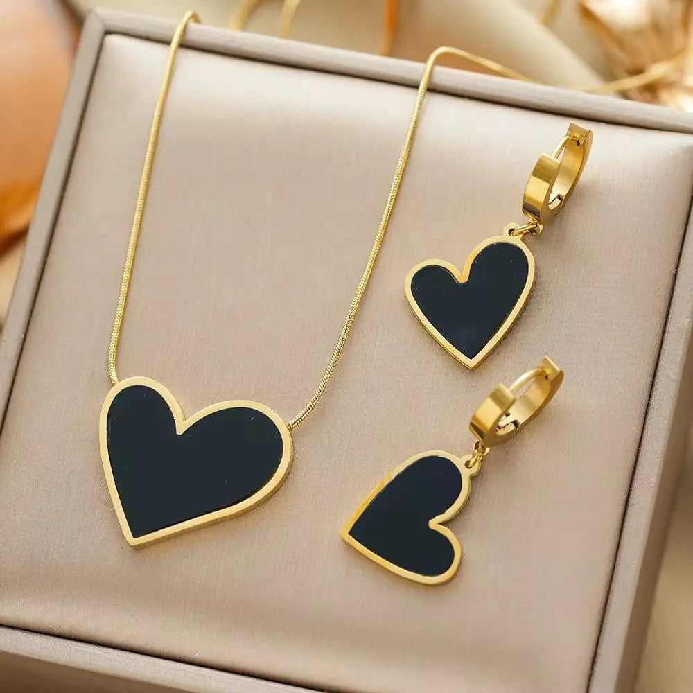 MARHOUHOU heart necklace and earring set with black enamel hearts and gold-tone edges