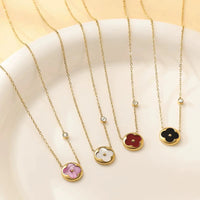 MARHOUHOU flower pendant necklace gift set with gold chains and colorful flower charms on white plate