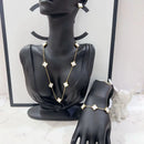 MARHOUHOU friendship necklace gift for her with white flower charms on gold chain displayed on black mannequin