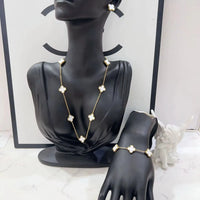 MARHOUHOU friendship necklace gift for her with white flower charms on gold chain displayed on black mannequin